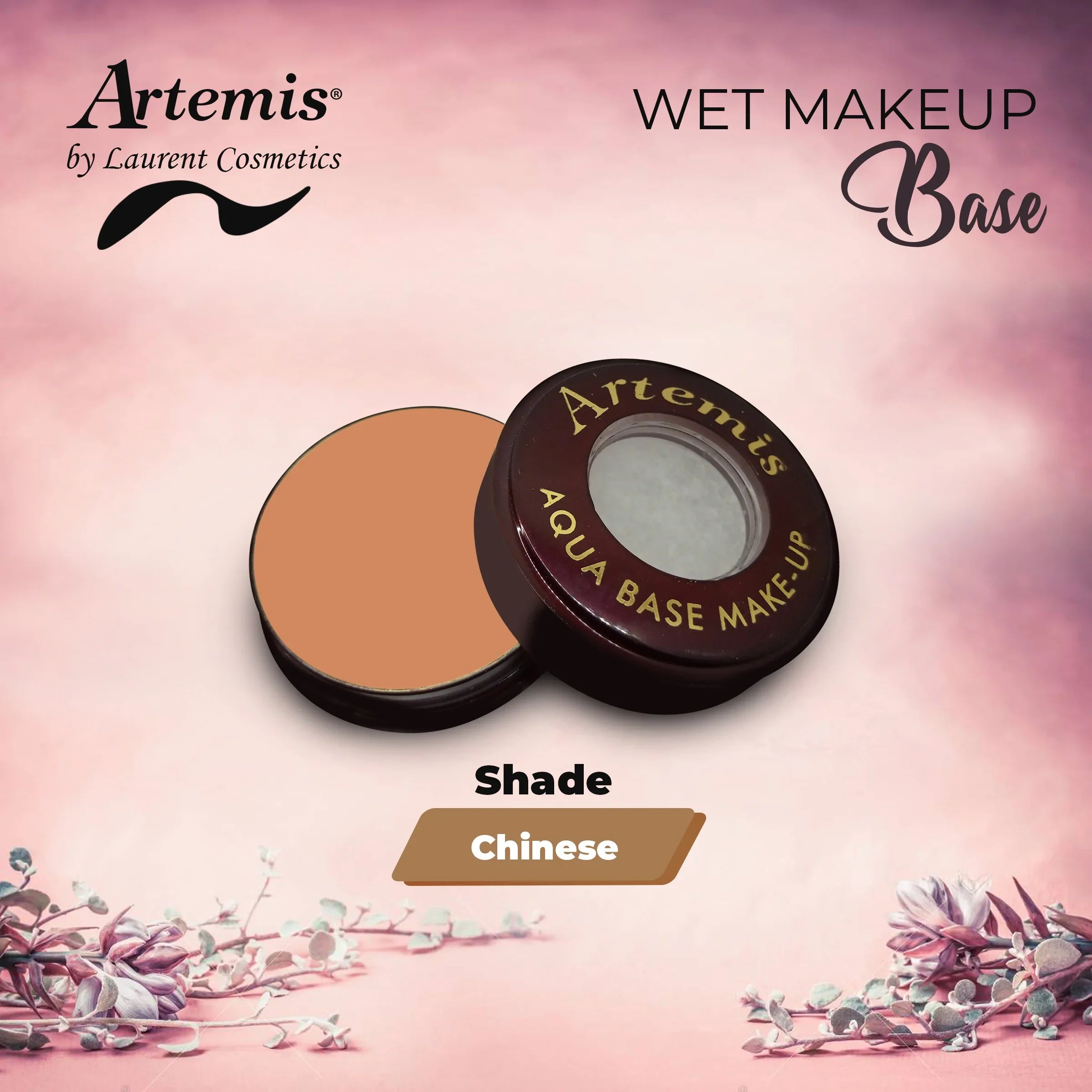 Artemis aqua base makeup in open compact, shade Chinese, on pink floral background.