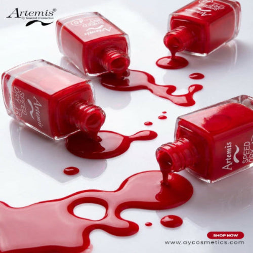 Red nail polish bottles with open caps, some on their sides with red liquid spilled on a white background, featuring the Artemis brand.