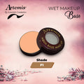 Artemis Aqua Base wet makeup in shade F1, open compact on pink floral background
