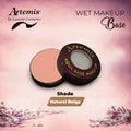 Artemis aqua base wet makeup in natural beige shade, open compact on pink floral background